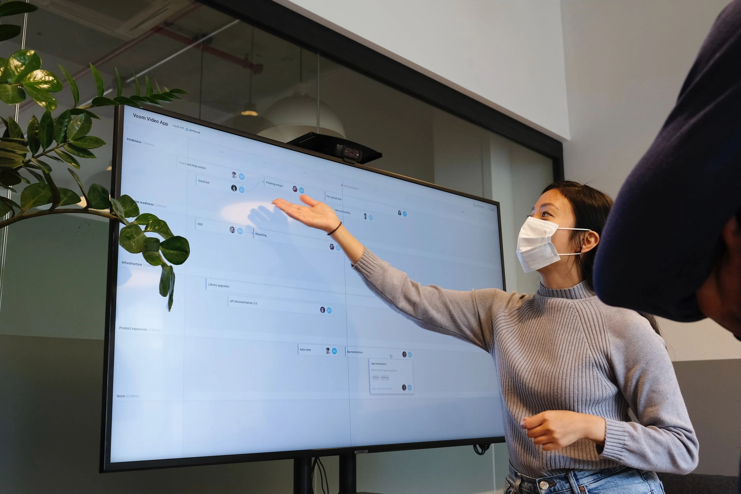 women presenting in a big screen